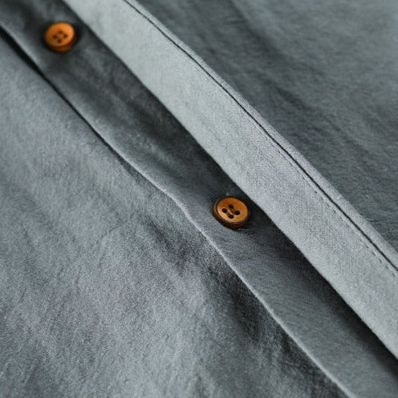 Close-up of the buttons on the band-collar shirt