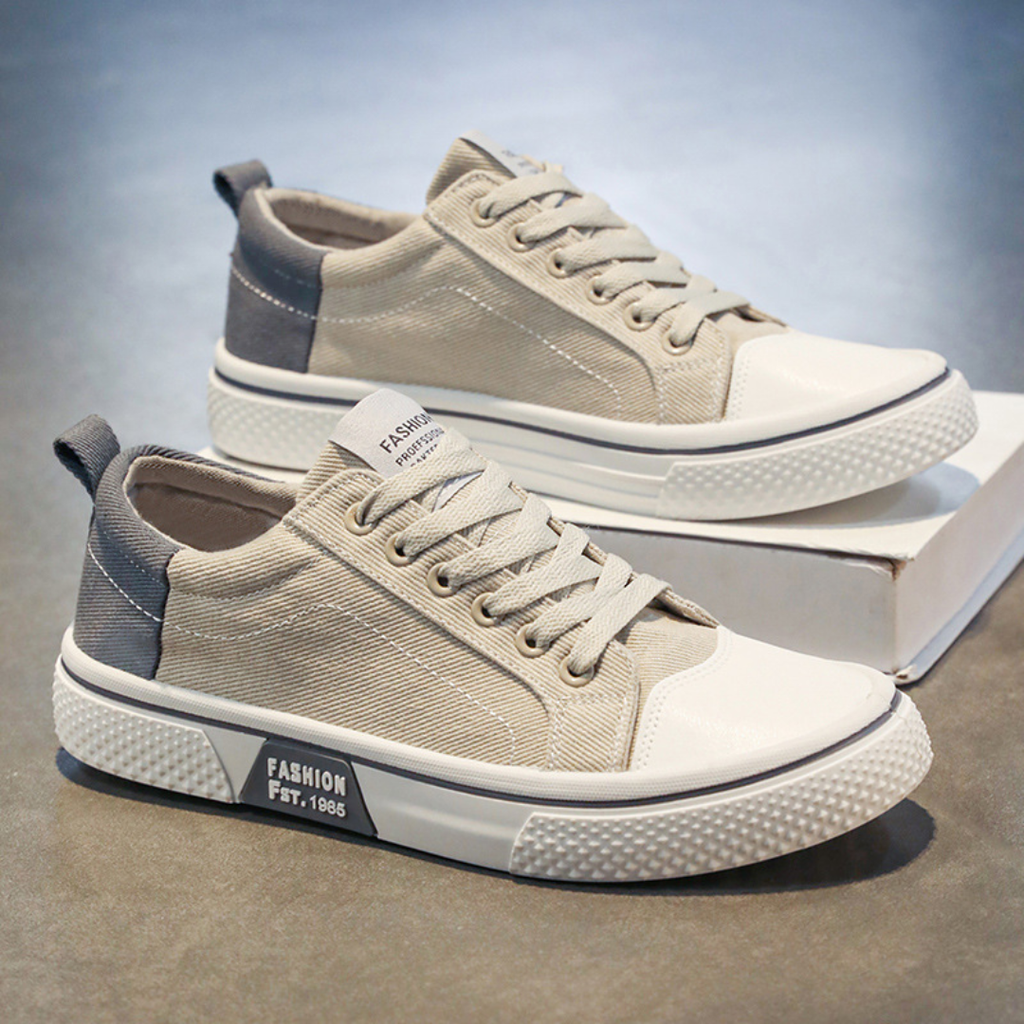 Beige canvas sneakers on a shoe box