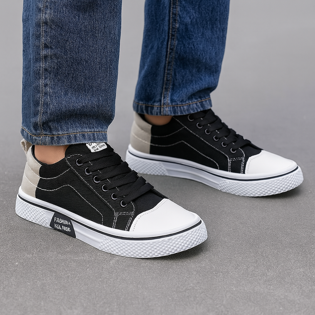 Man wearing black canvas low-top sneakers