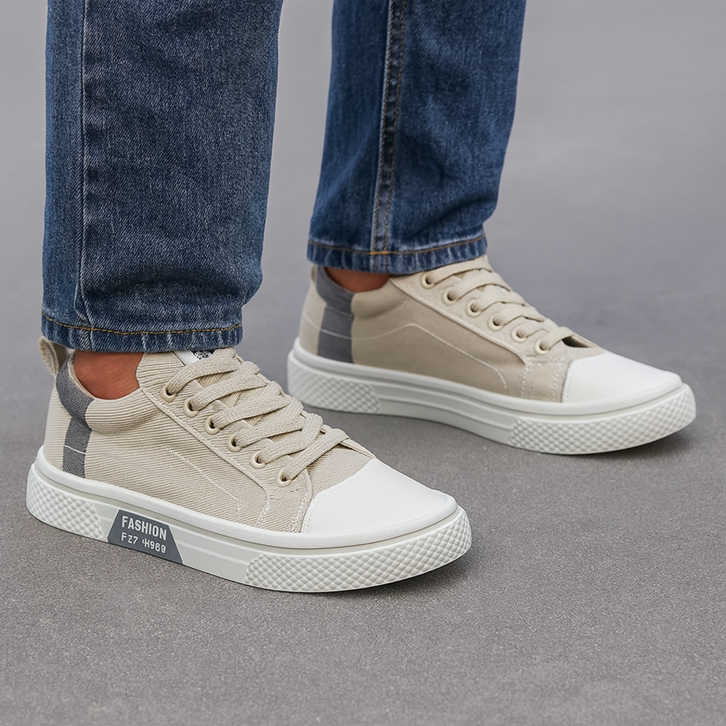 Man wearing beige canvas sneakers
