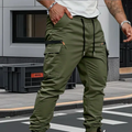 Man wearing green cargo joggers with drawstring waist