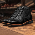Men's black lace-up ankle boots on a wooden shelf