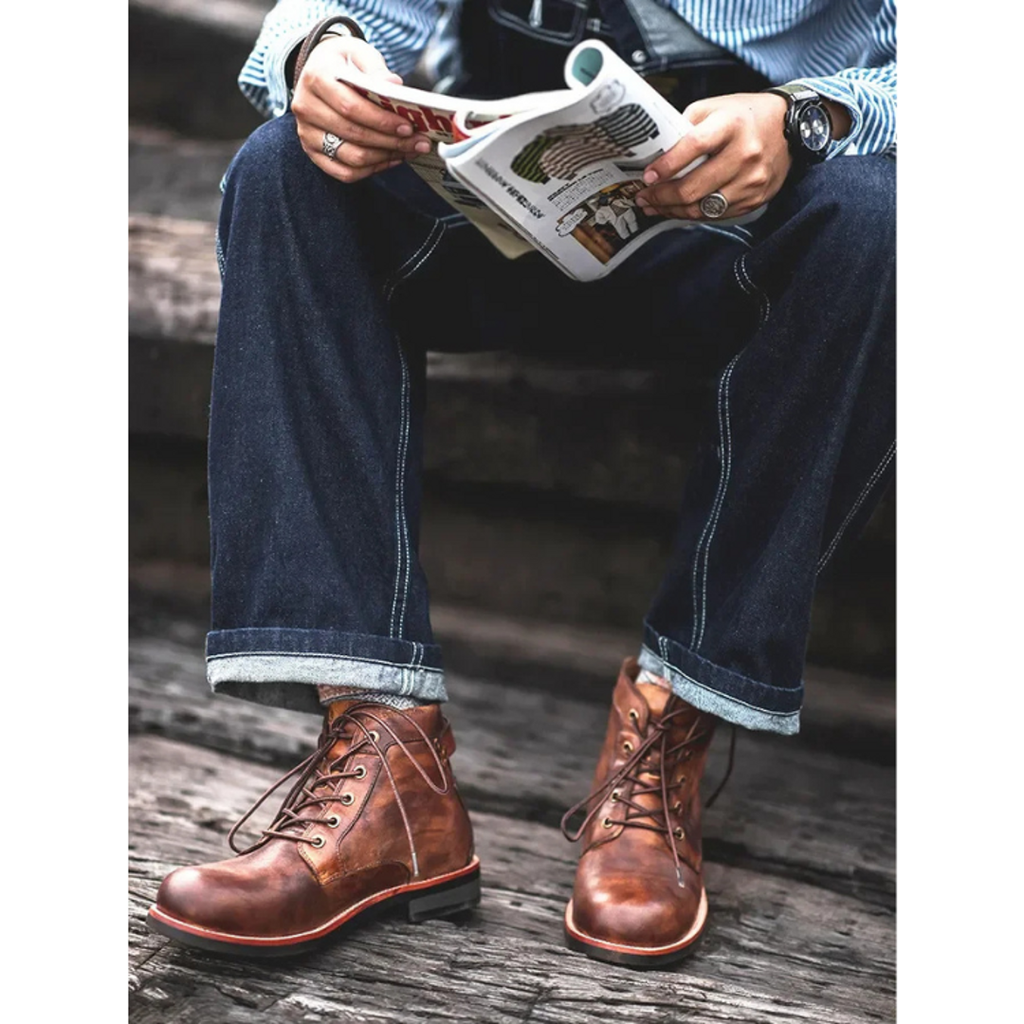 Man wearing brown ankle boots with jeans