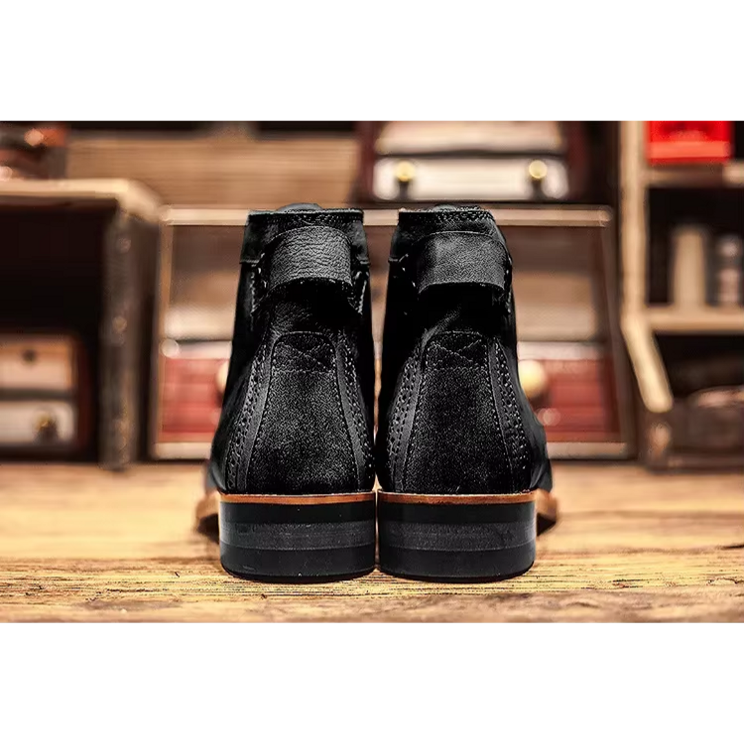 Pair of black lace-up ankle boots – front view