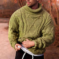 Man wearing a green chunky cable knit turtleneck