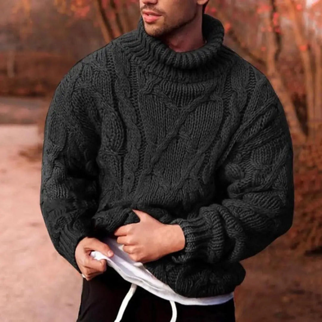 Man wearing a black cable knit turtleneck sweater
