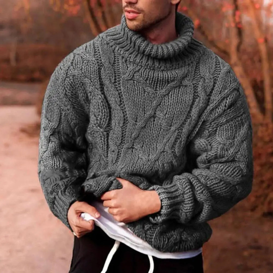 Man wearing a grey chunky turtleneck sweater