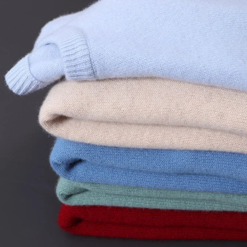 Stack of crew neck sweaters in several colours