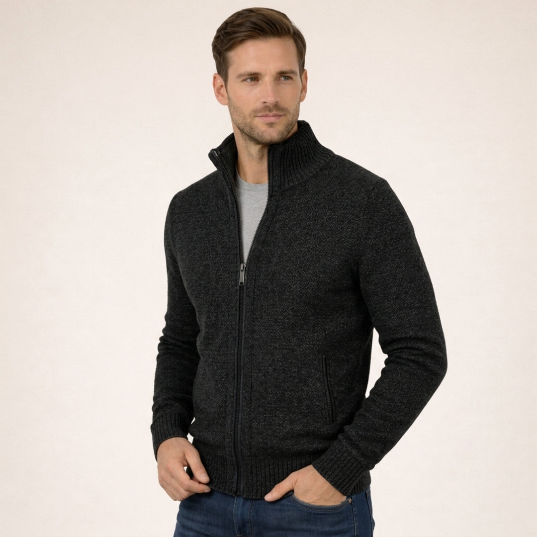 Man wearing a black zip cardigan with stand collar