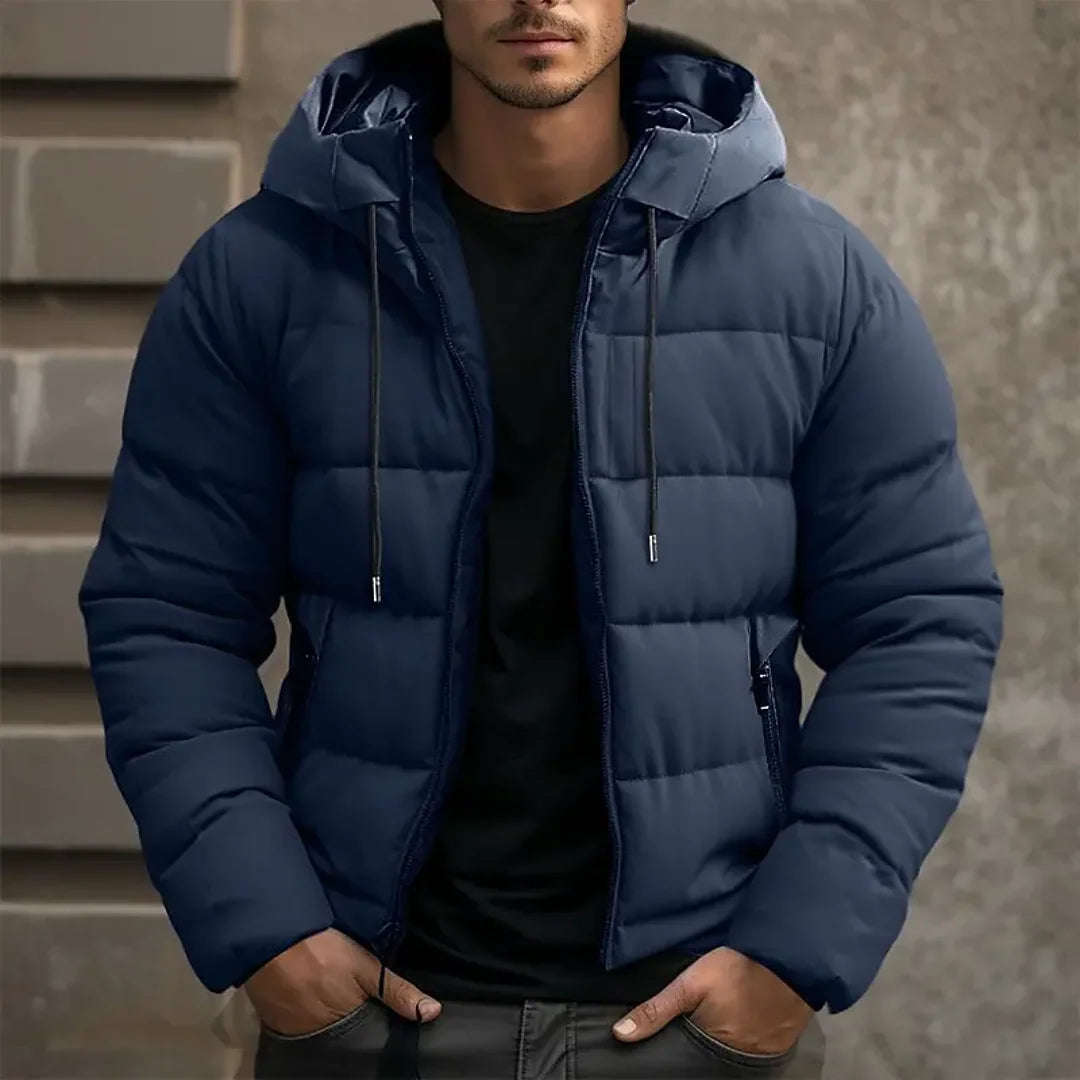 Man wearing a navy hooded quilted puffer jacket