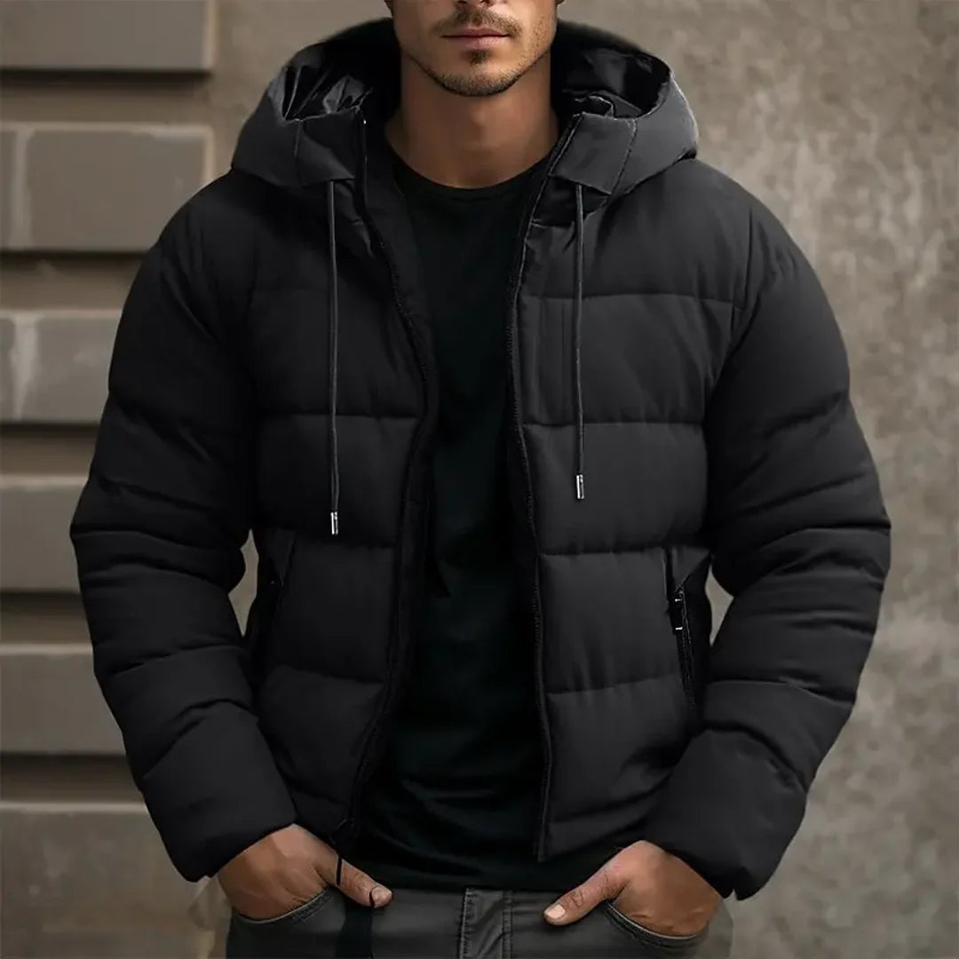 Man wearing a black hooded puffer jacket