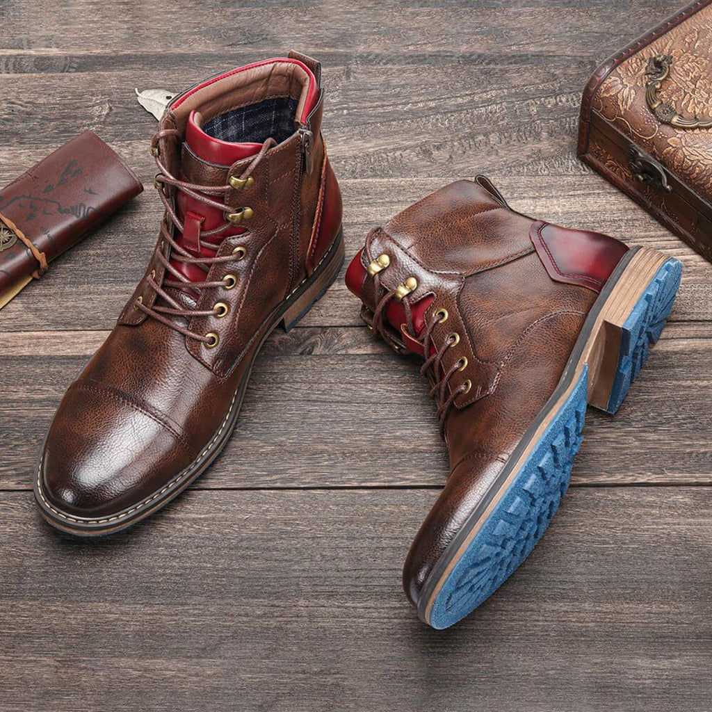 Men's brown lace-up boots on a wooden floor