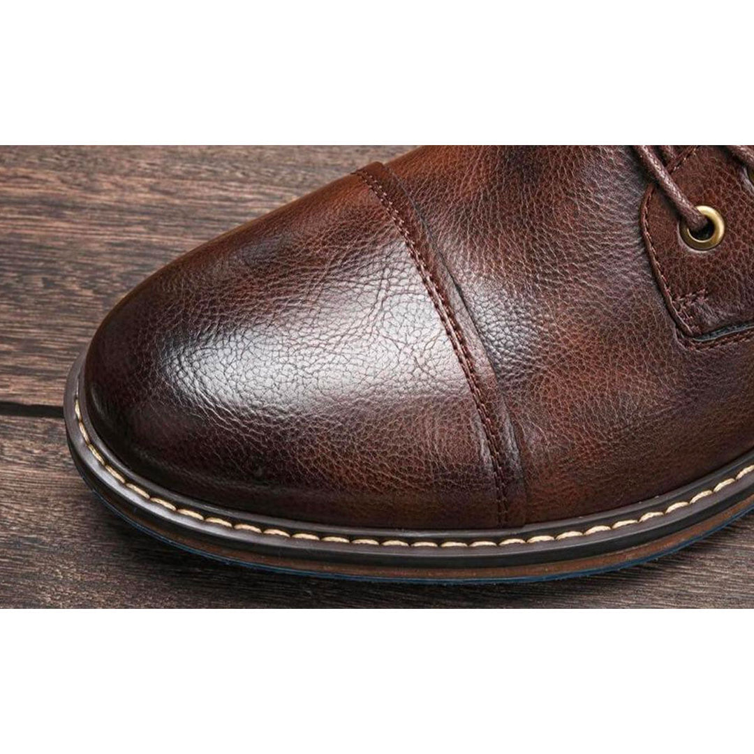 Close-up of the cap toe on the men's brown boot