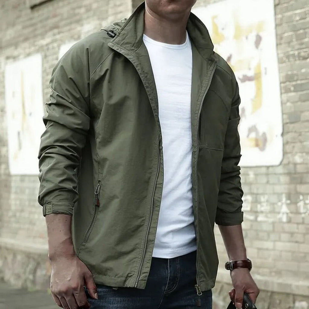 Man wearing a green cargo jacket with white tee