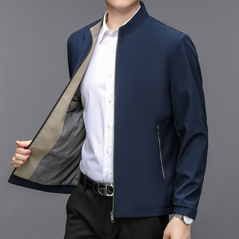 Man wearing the dark blue zip jacket open