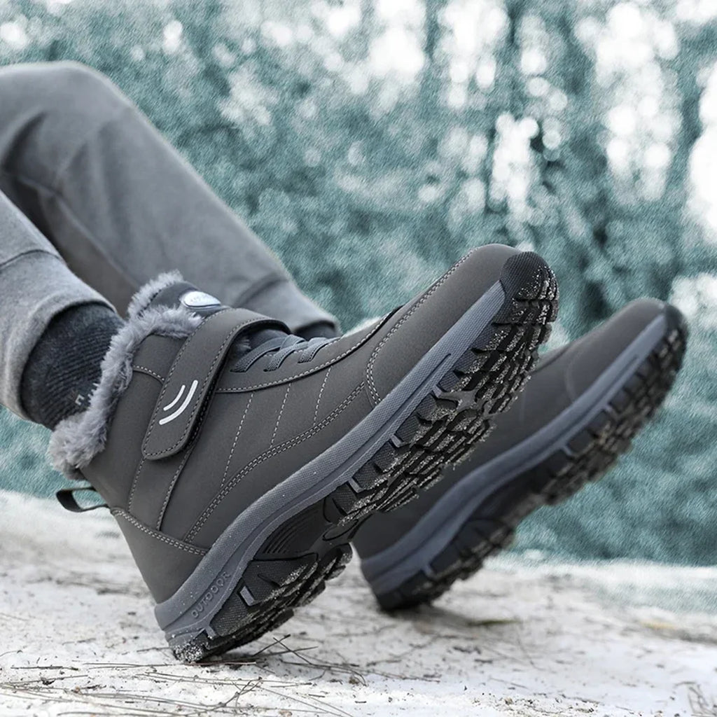 Men's grey winter boots showing the tread sole
