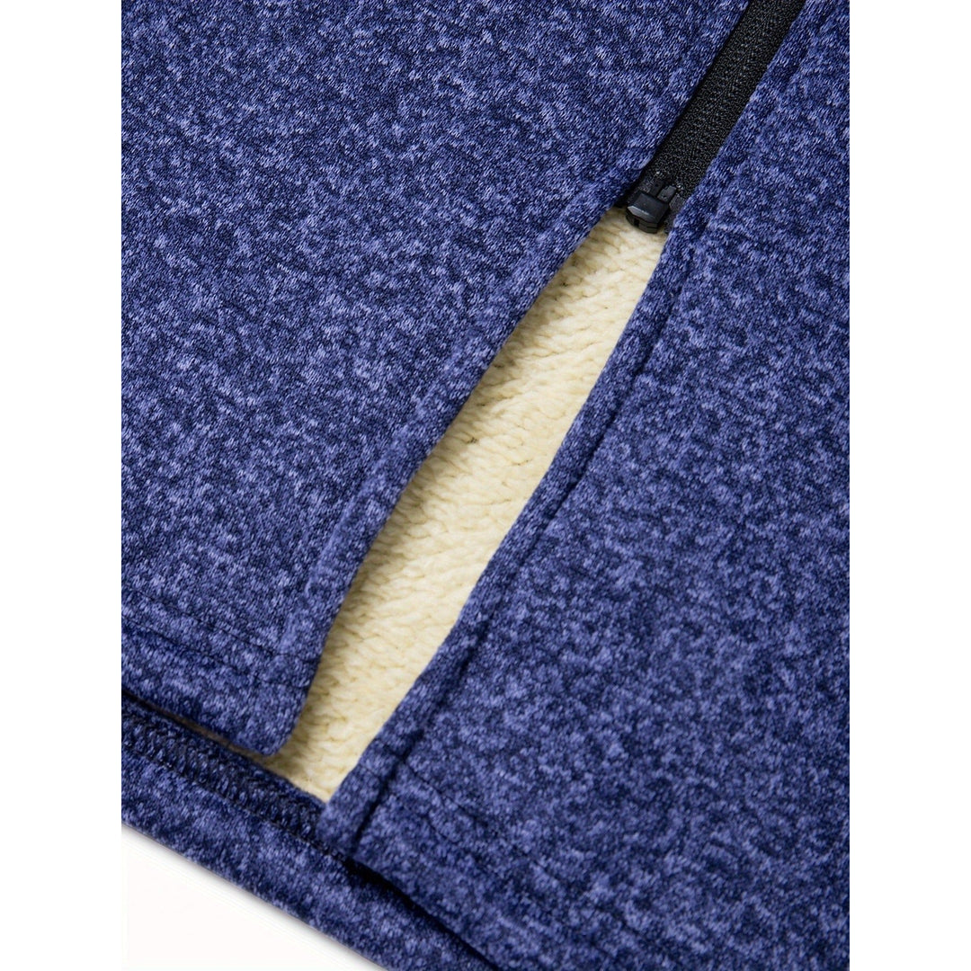 Close-up of the pocket on the blue melange coat