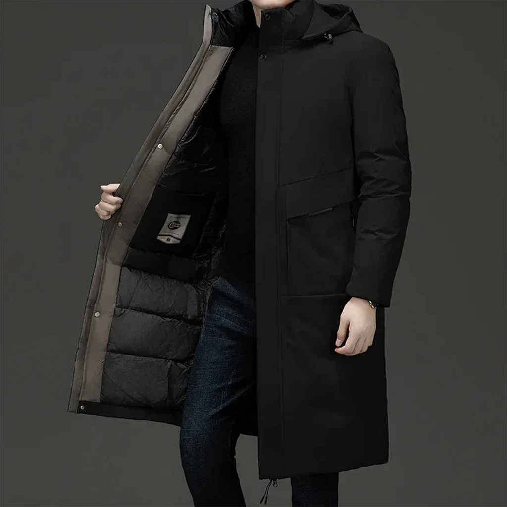 Man wearing a black long hooded winter coat