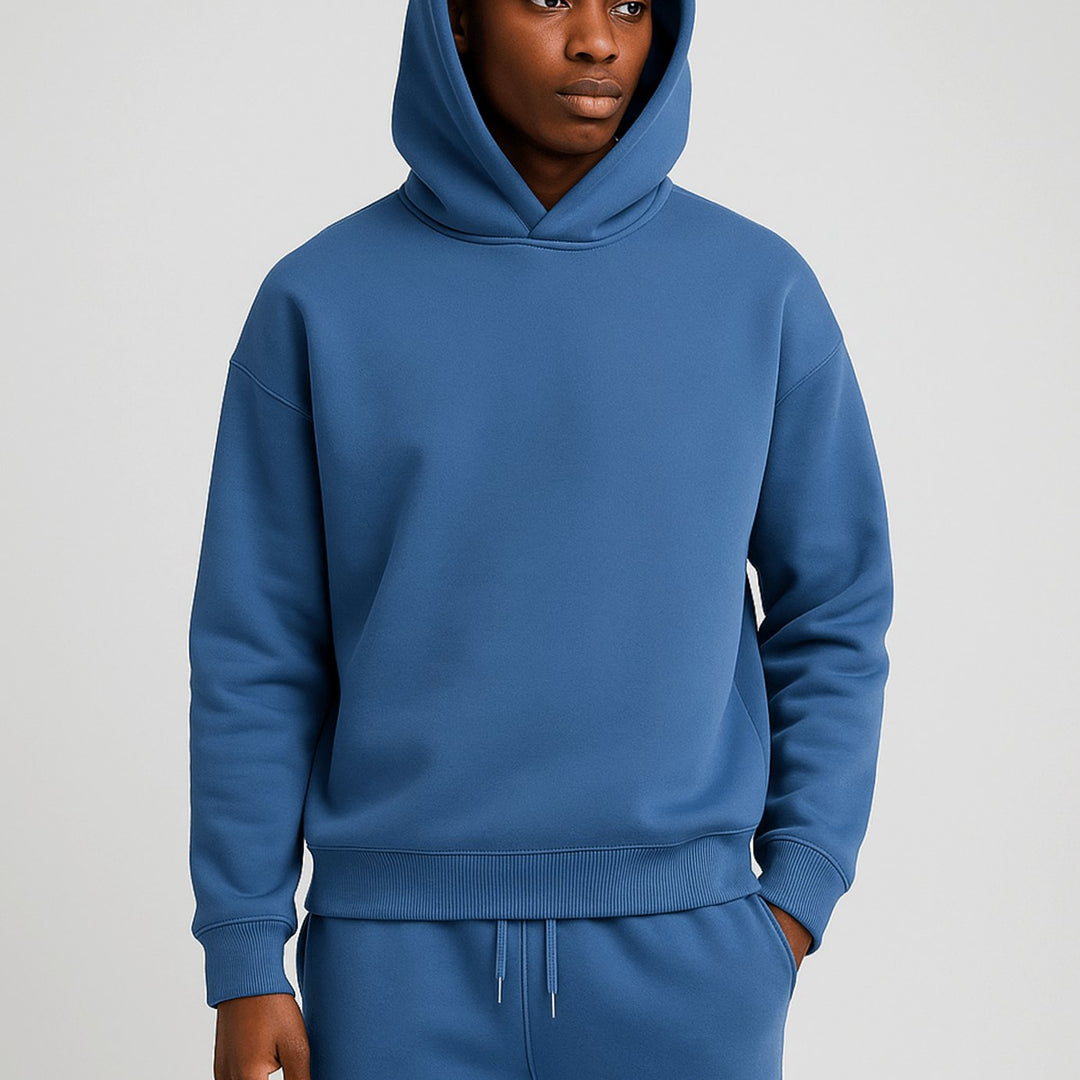 Man wearing a blue oversized hoodie and jogger set