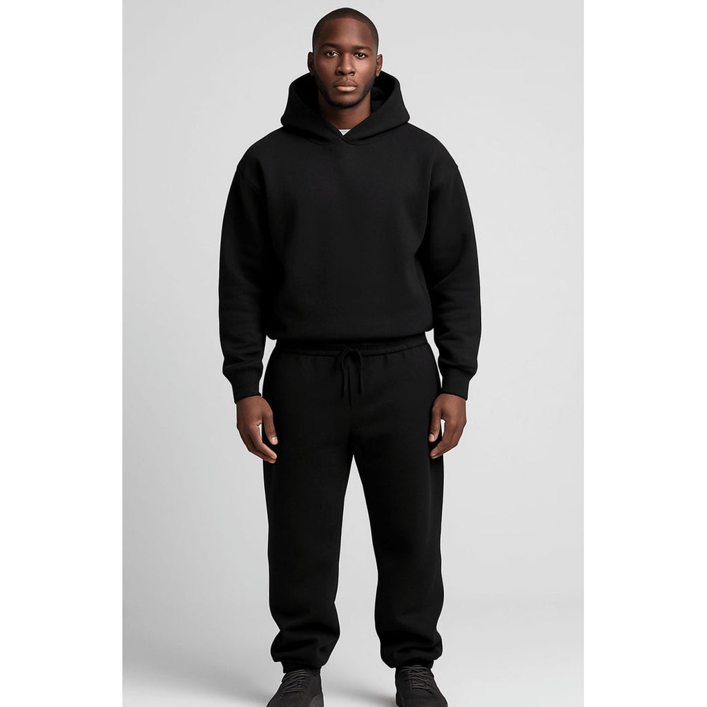 Man wearing a black hoodie and jogger set