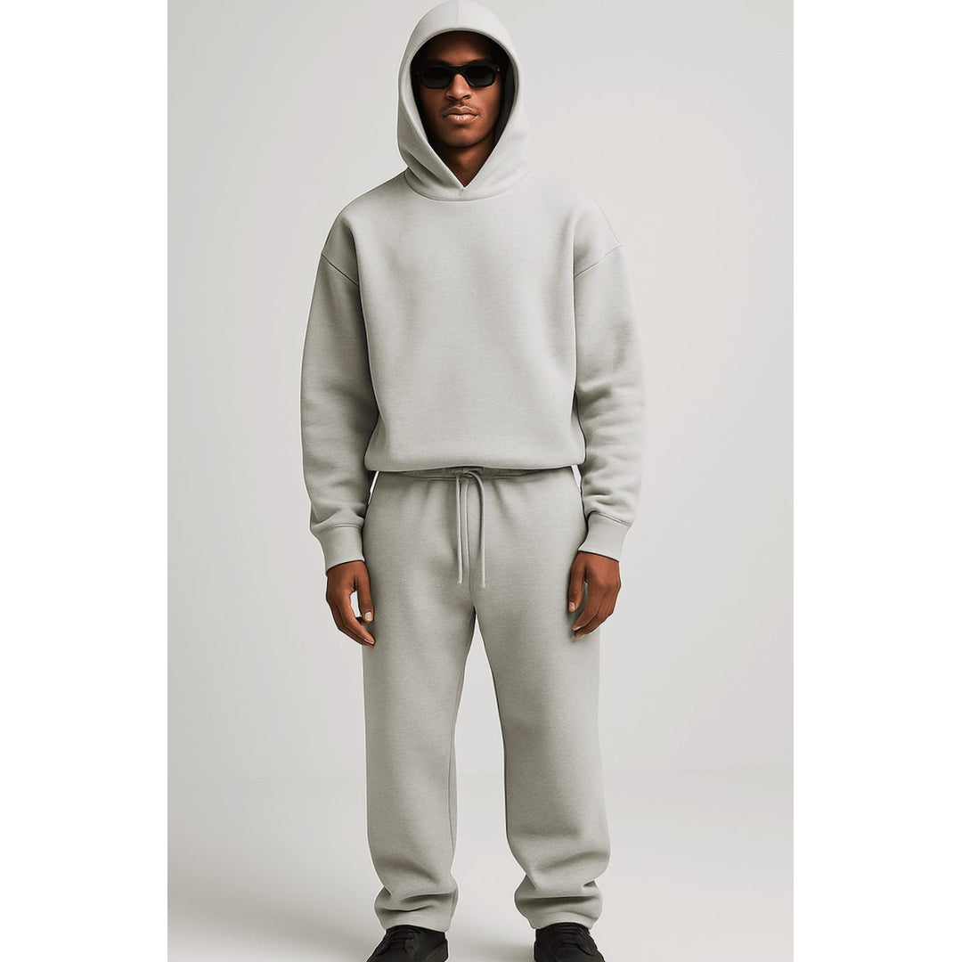 Man wearing a light grey oversized tracksuit set