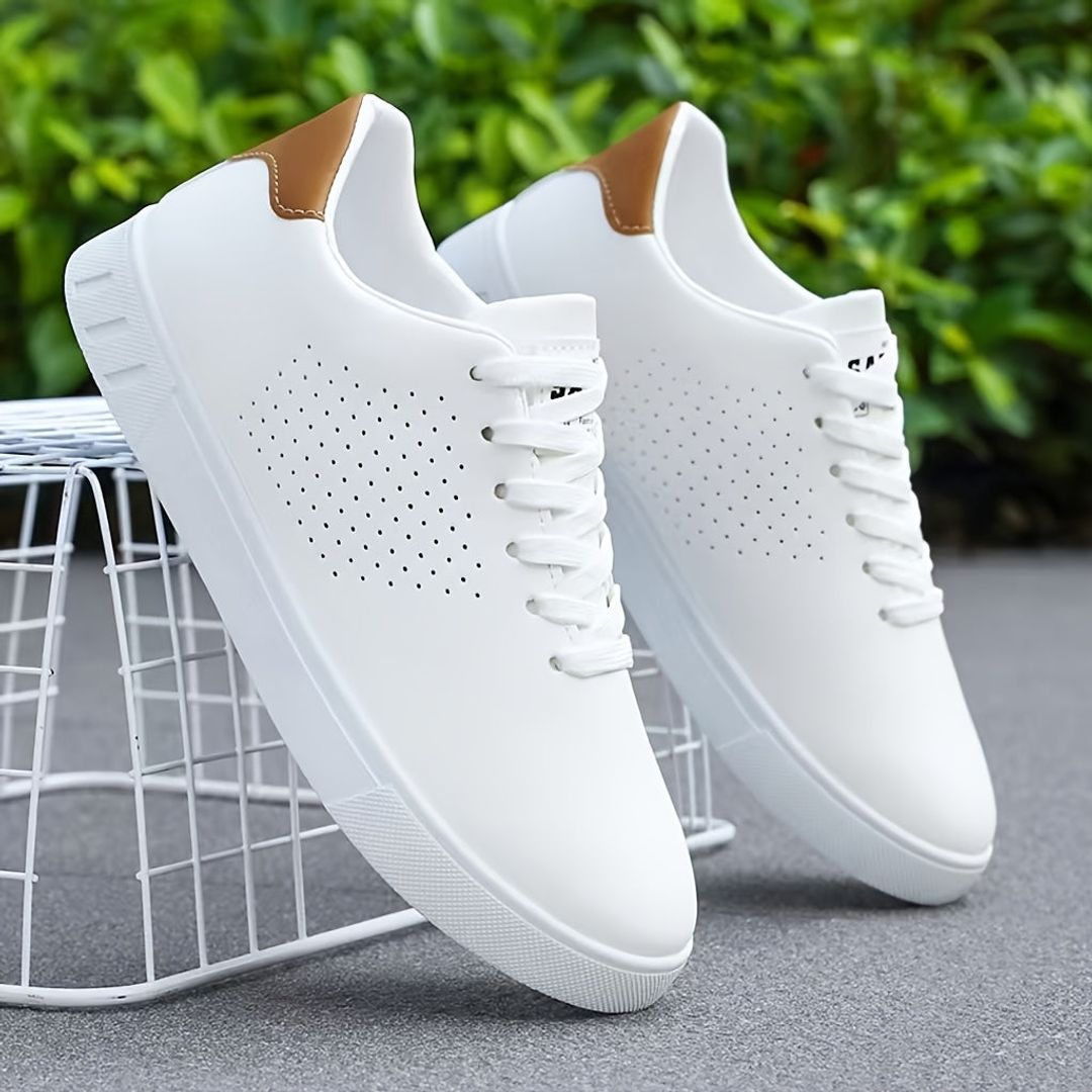 Men's perforated low top sneakers in white, outdoors