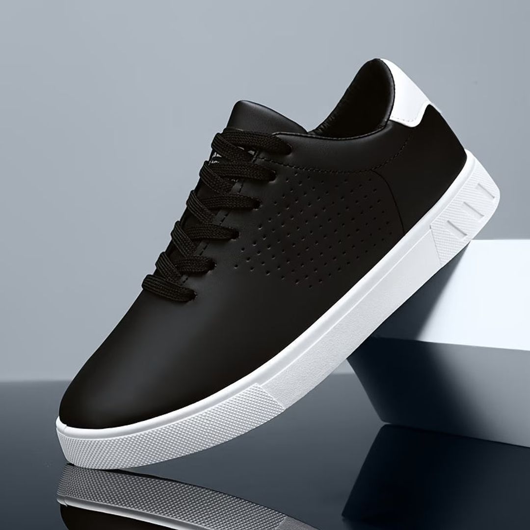 Men's perforated low top sneakers in black, side view