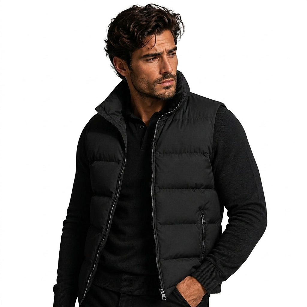Man wearing a black puffer gilet over a black jumper