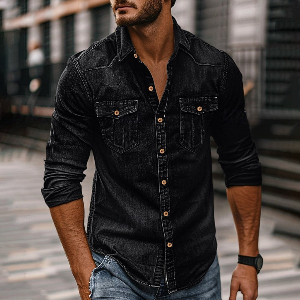 Man wearing a black button-up shirt with chest pockets
