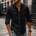 Man wearing a black button-up shirt with chest pockets