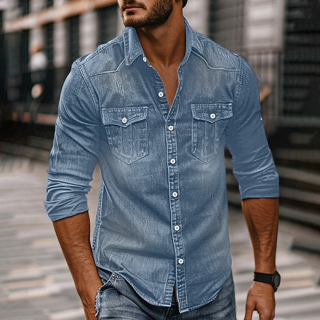 Man wearing a denim blue button-up shirt with chest pockets