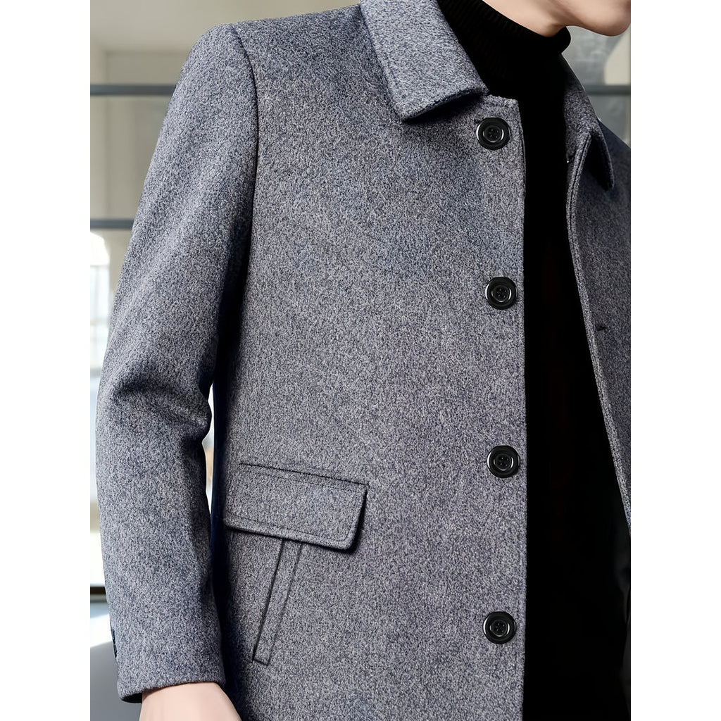 Close-up of the flap pocket on the grey overcoat