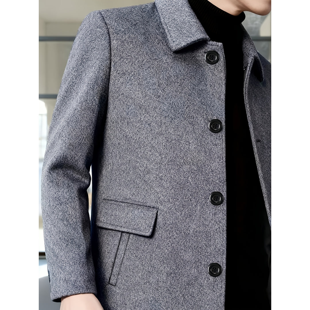 Close-up of the flap pocket on the grey overcoat