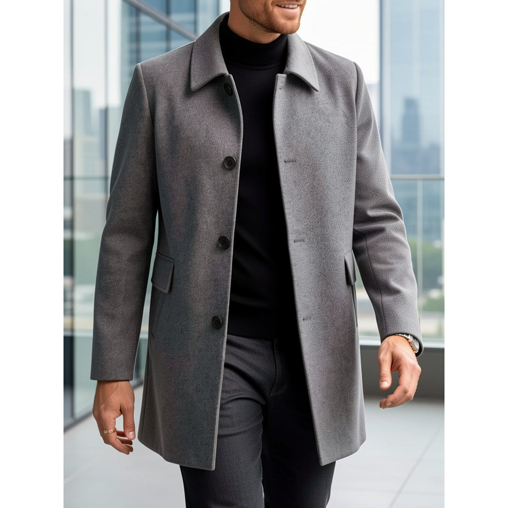 Man walking in a dark grey short overcoat