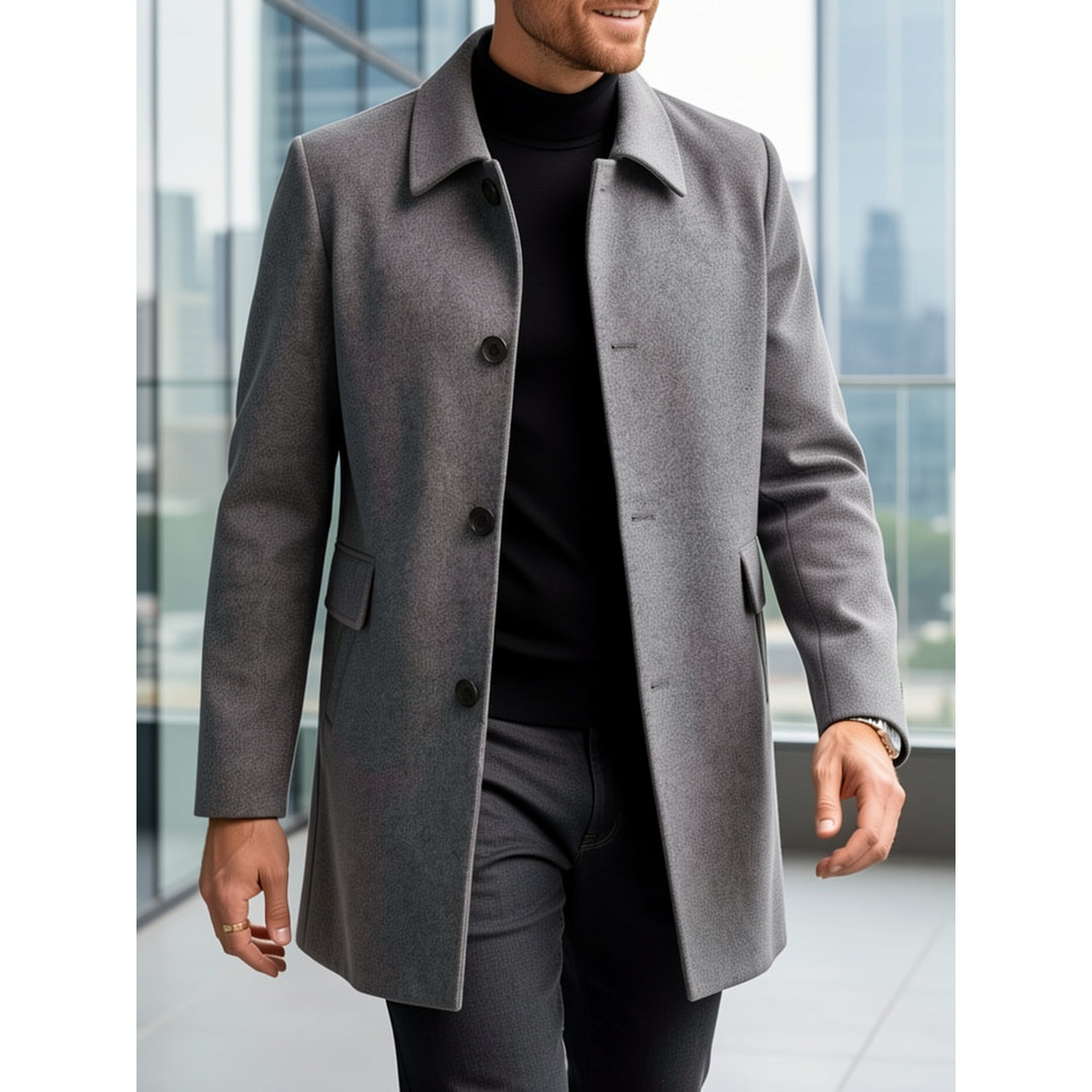 Man walking in a dark grey short overcoat