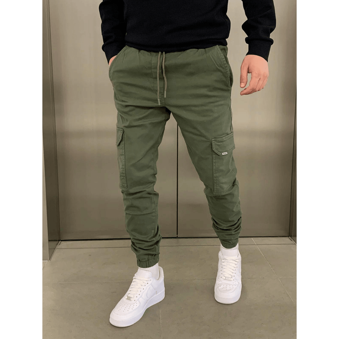 Man wearing olive green slim cargo joggers