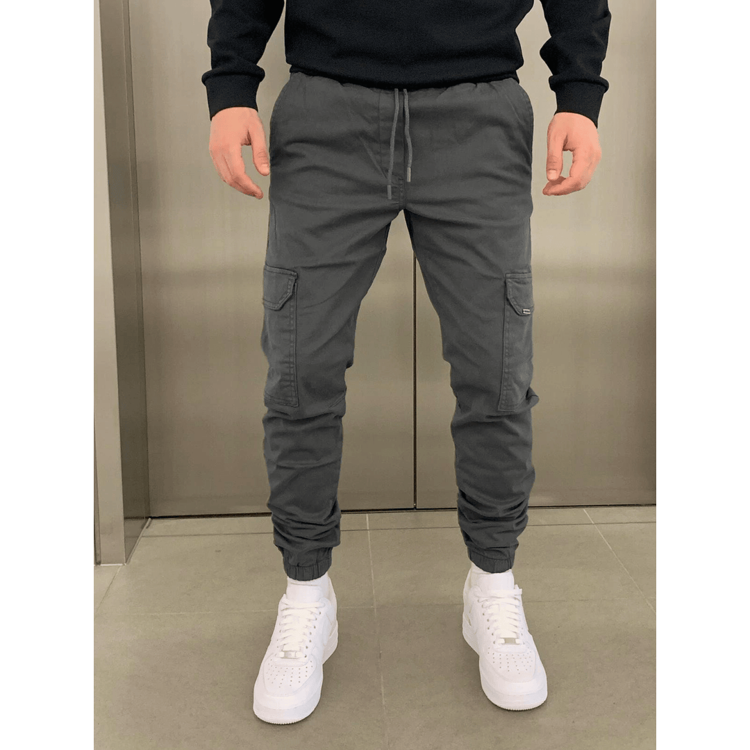 Man wearing grey cargo joggers with cuffed ankles
