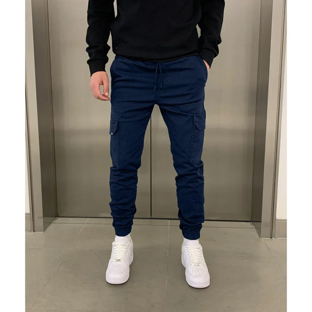 Man wearing navy slim cargo joggers
