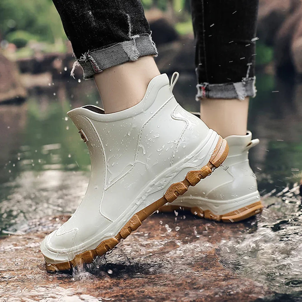 Men's beige rain boots worn outdoors