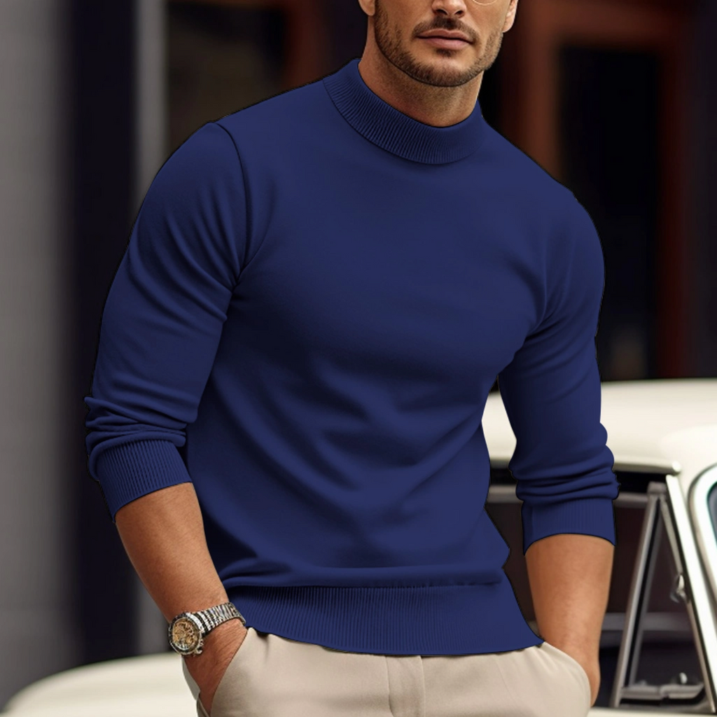 Man wearing a blue crew neck knit sweater