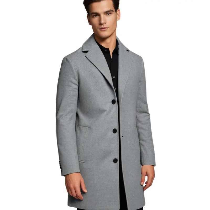Man wearing the light grey knee-length coat