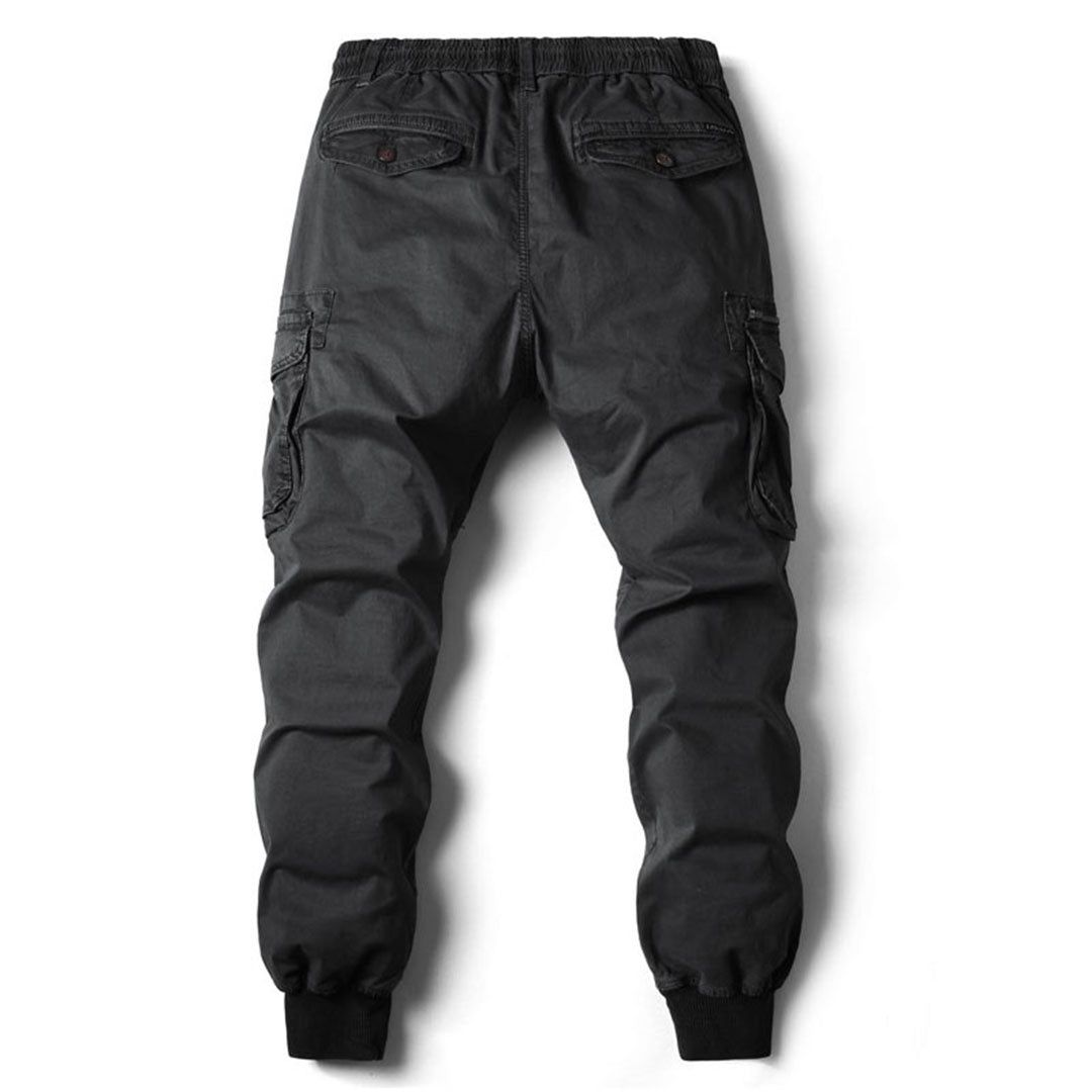 Men's tapered cargo trousers in black, side view