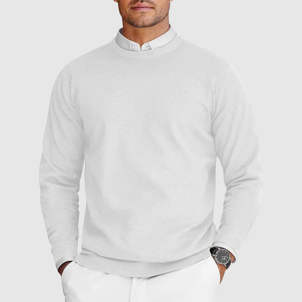 Man wearing a white crew neck knit sweater