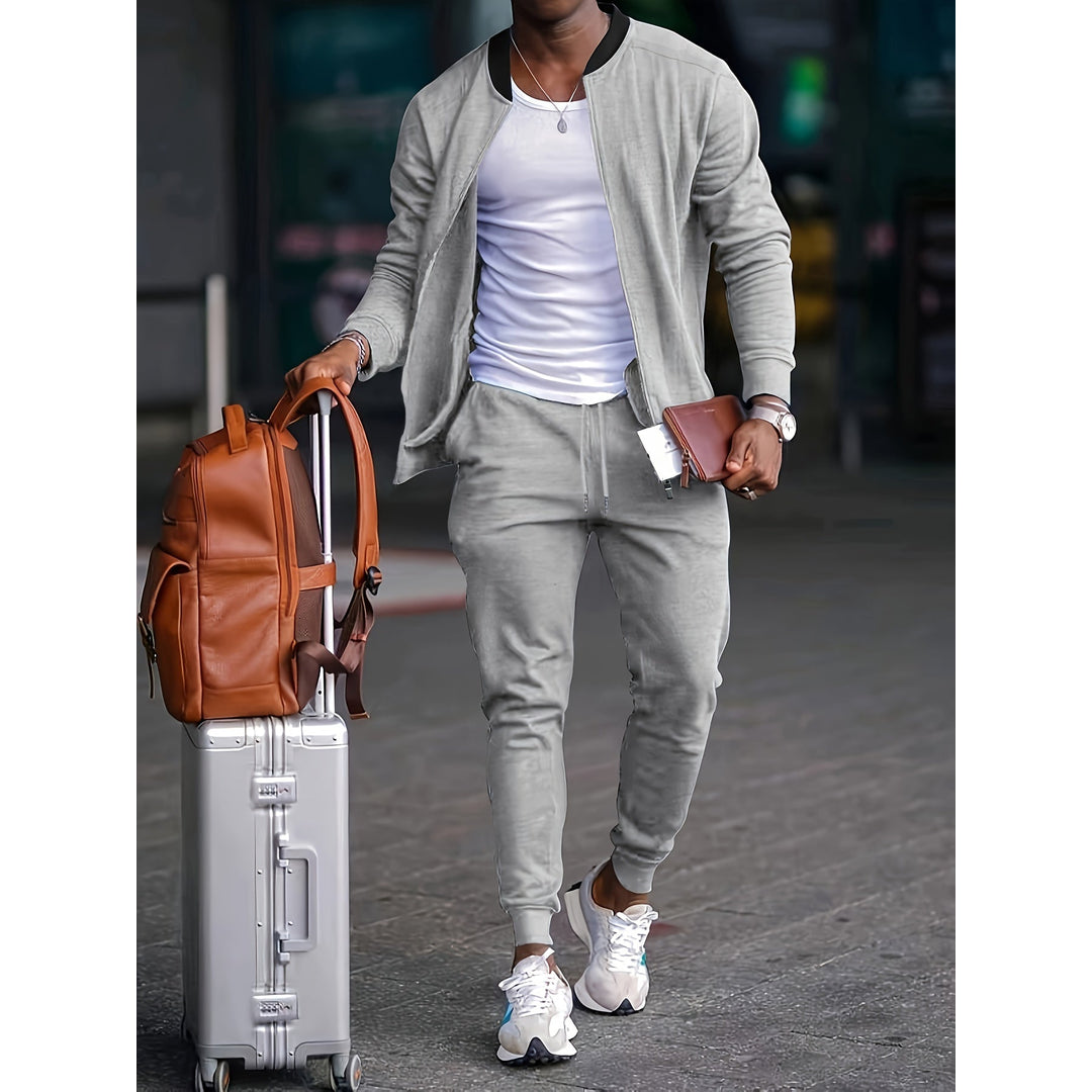 Man wearing a grey zip jacket and joggers set