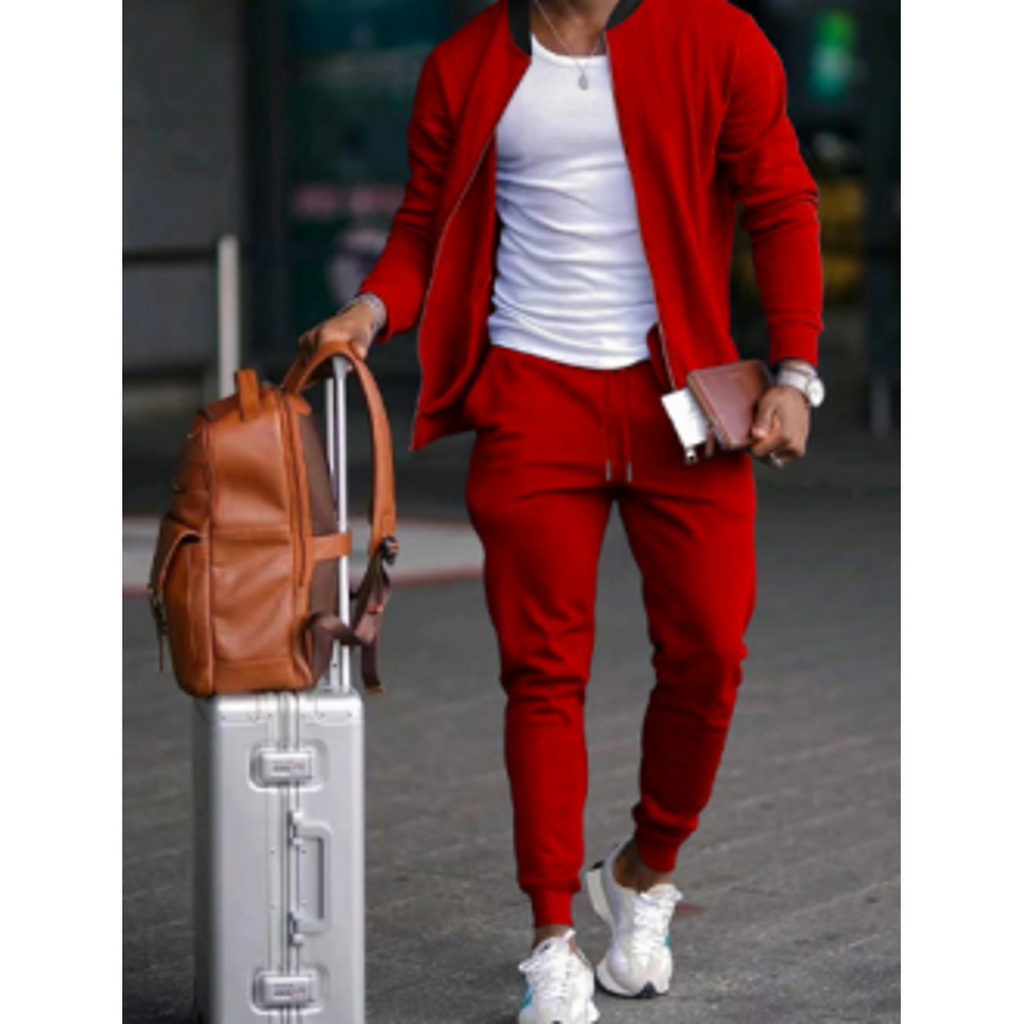 Man wearing a red tracksuit with a white tee