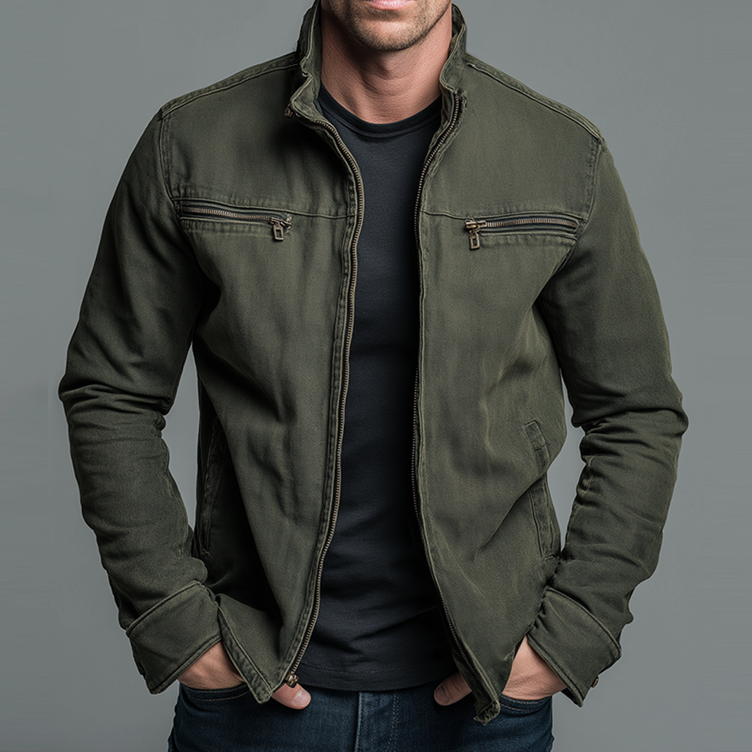 Man wearing a green zip jacket over a black tee