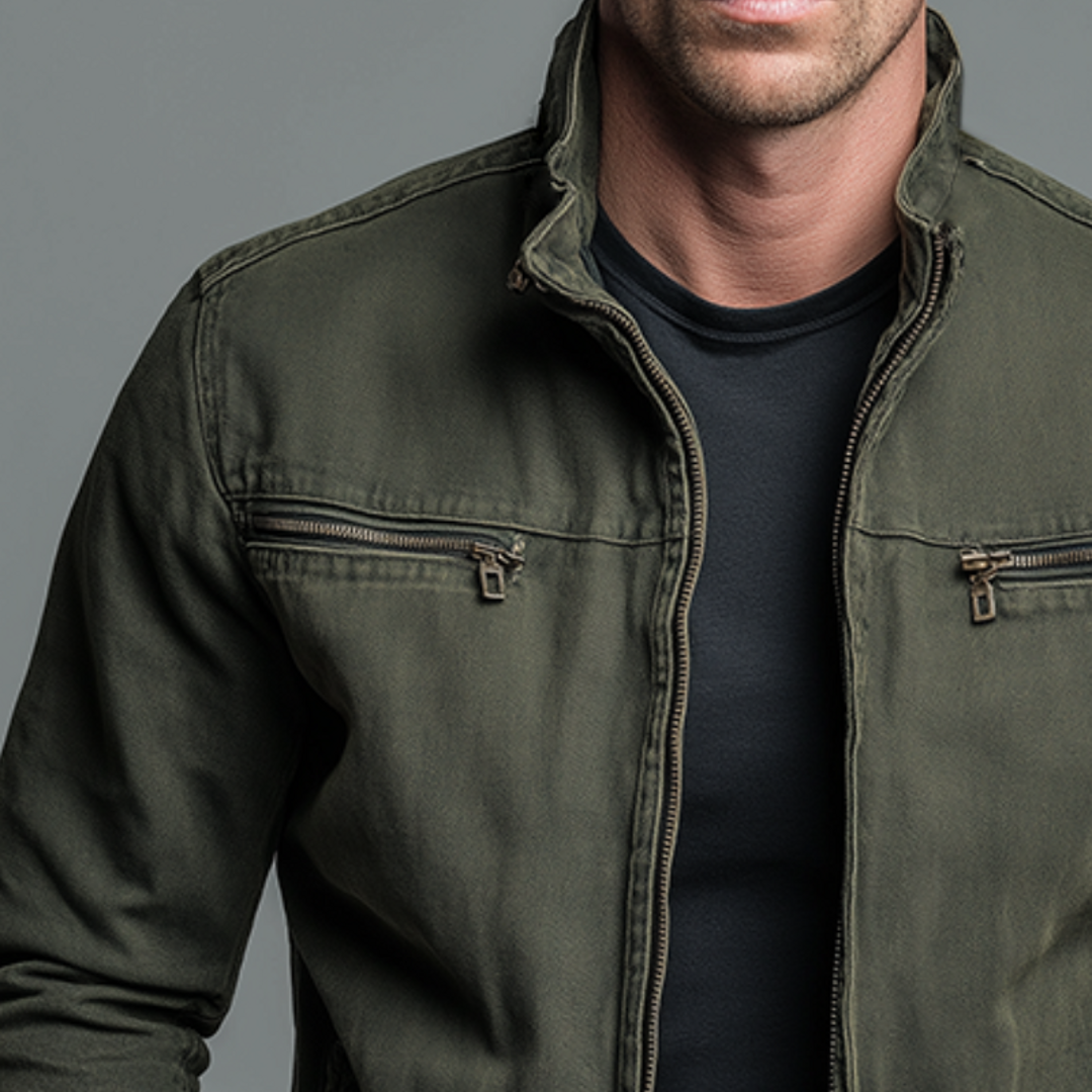 Close-up of the zipped chest pocket on the green jacket
