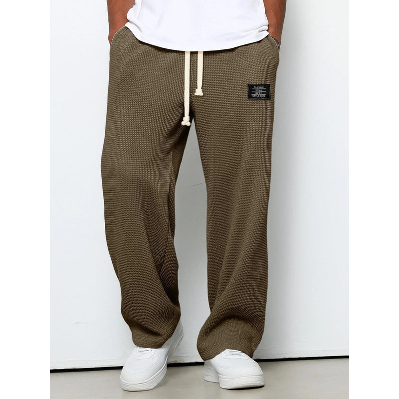 Men's relaxed fit drawstring trousers in brown