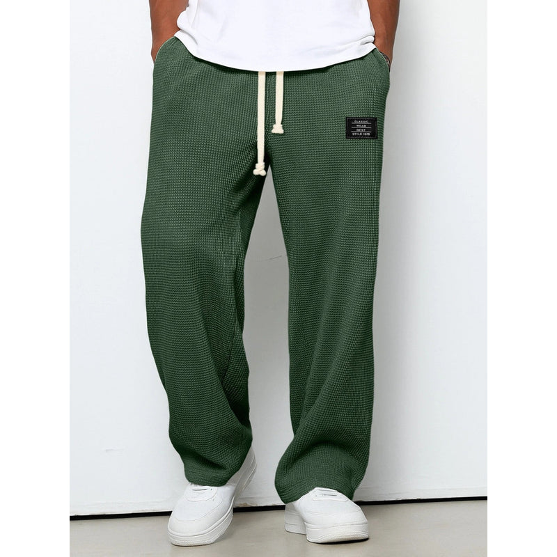 Men's relaxed fit drawstring trousers in dark green