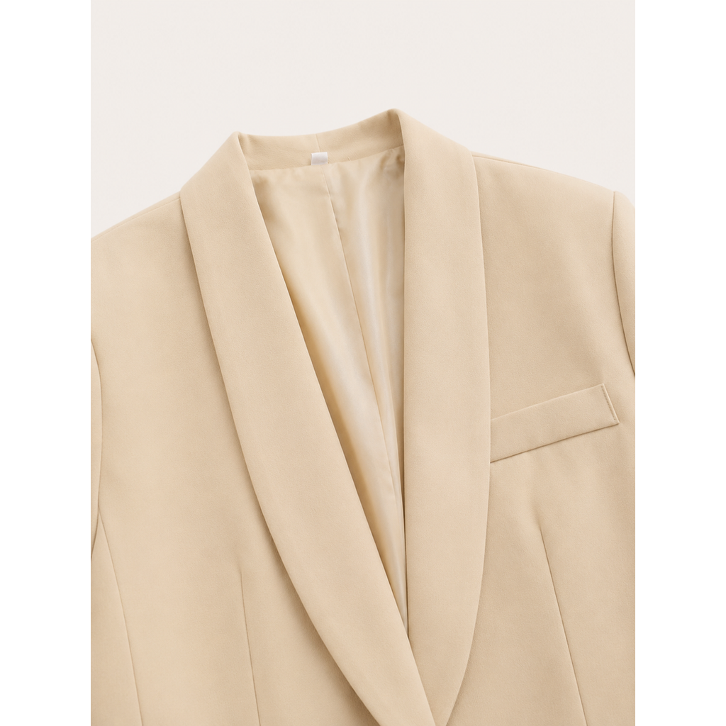 Close-up of the shawl lapel on the beige blazer